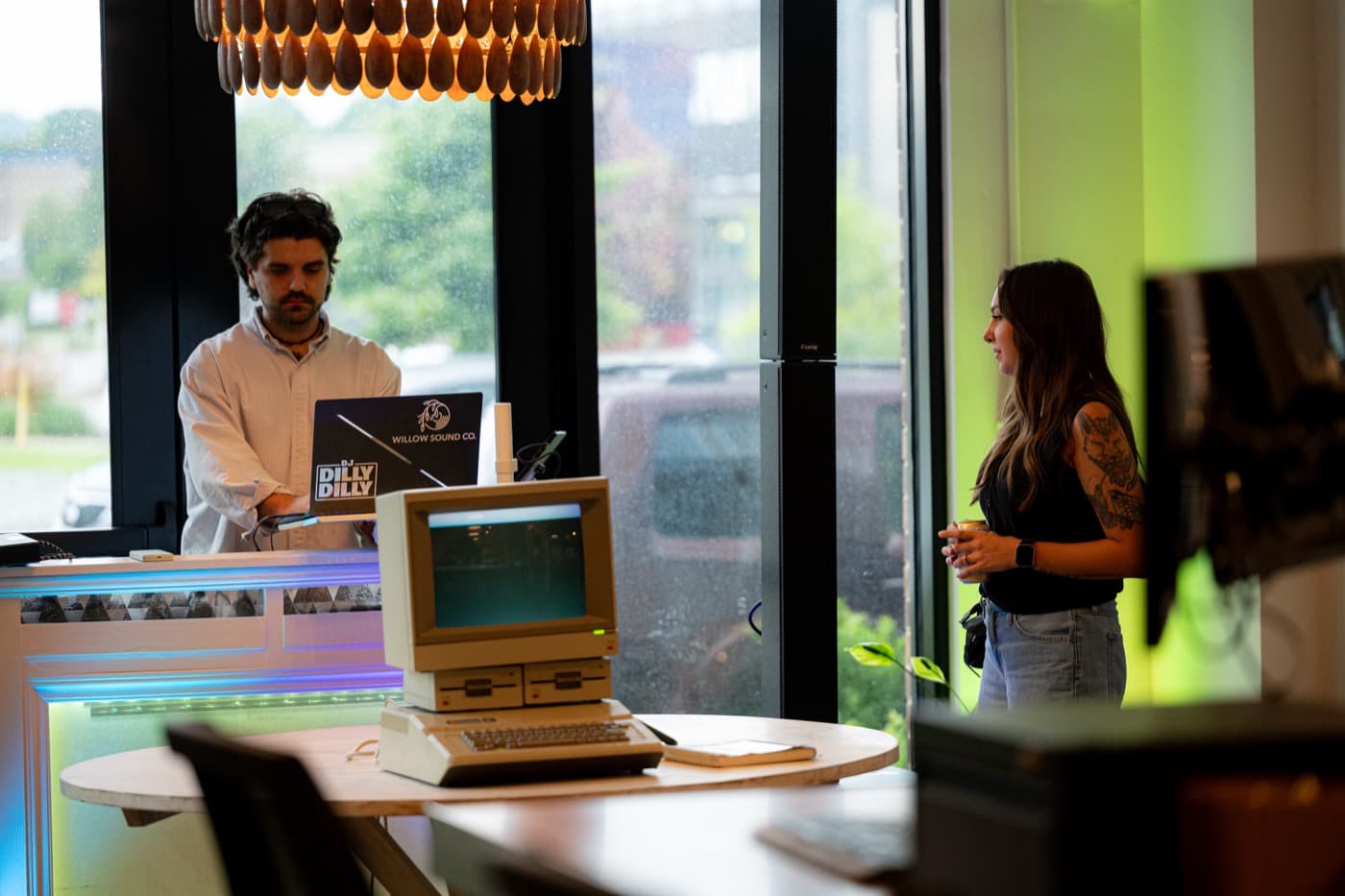 DevHouse First Room — vintage Mac, DJ station, and green light at Apollo Coalition