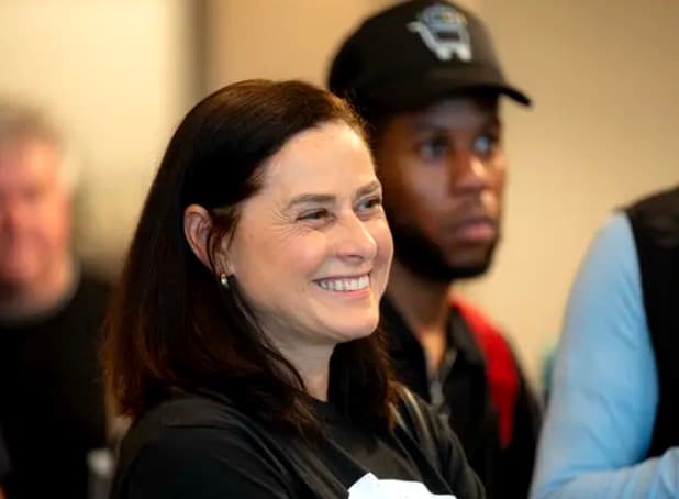 Marianne Whitehead smiling at DevHouse First Room