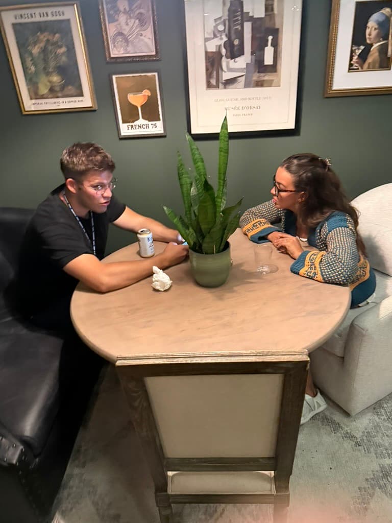 DevHouse Room #3 — Table talk. Snake plant. Somebody's phone out.